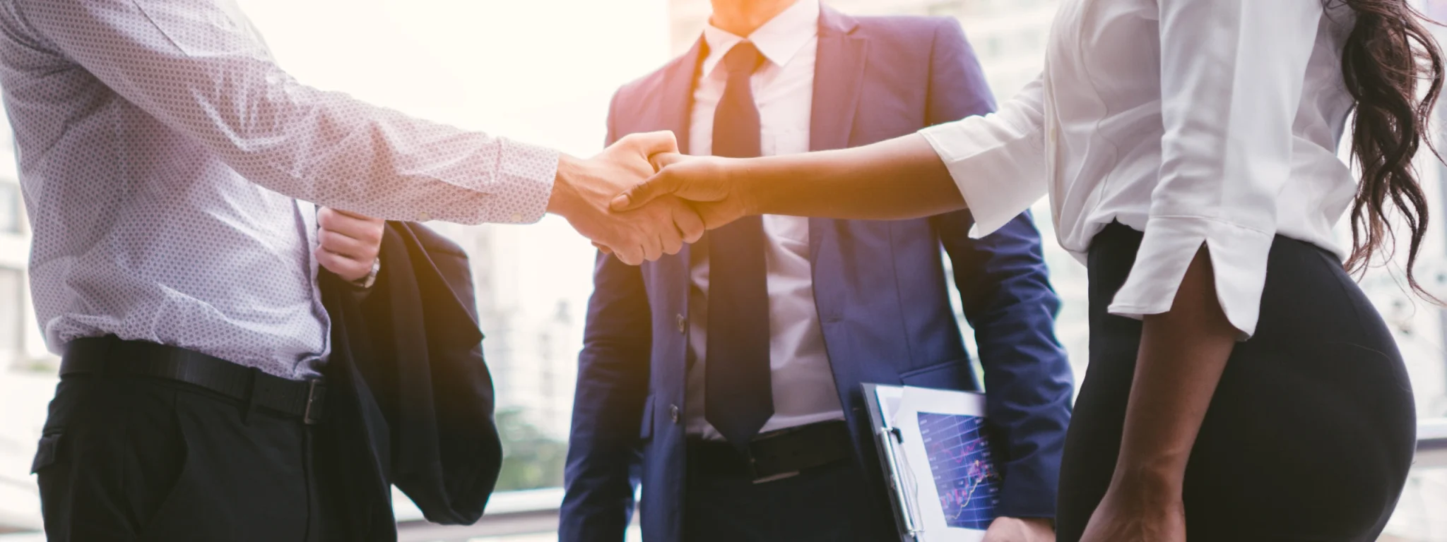 Group of Men Shaking Hands on a Benefits Deal